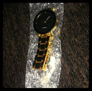 Gold Quartz watch with black face